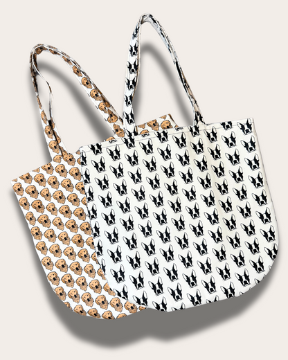 Two eco-friendly tote bags by House of Woof featuring hand-drawn Boston Terrier and Golden Retriever patterns, made from recycled and organic cotton.