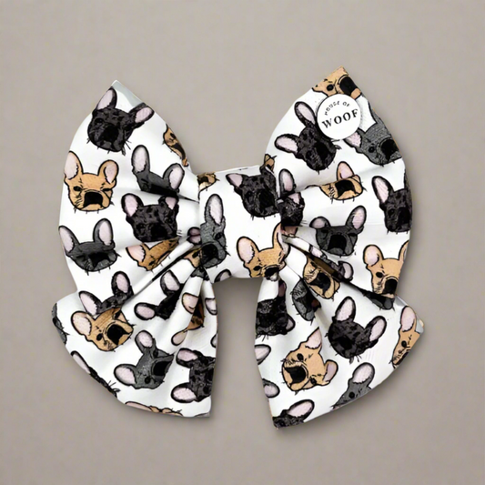 Hand-drawn French Bulldog print sailor bow dog accessory with multiple colour variations, designed to easily attach to a collar for a secure and stylish fit.