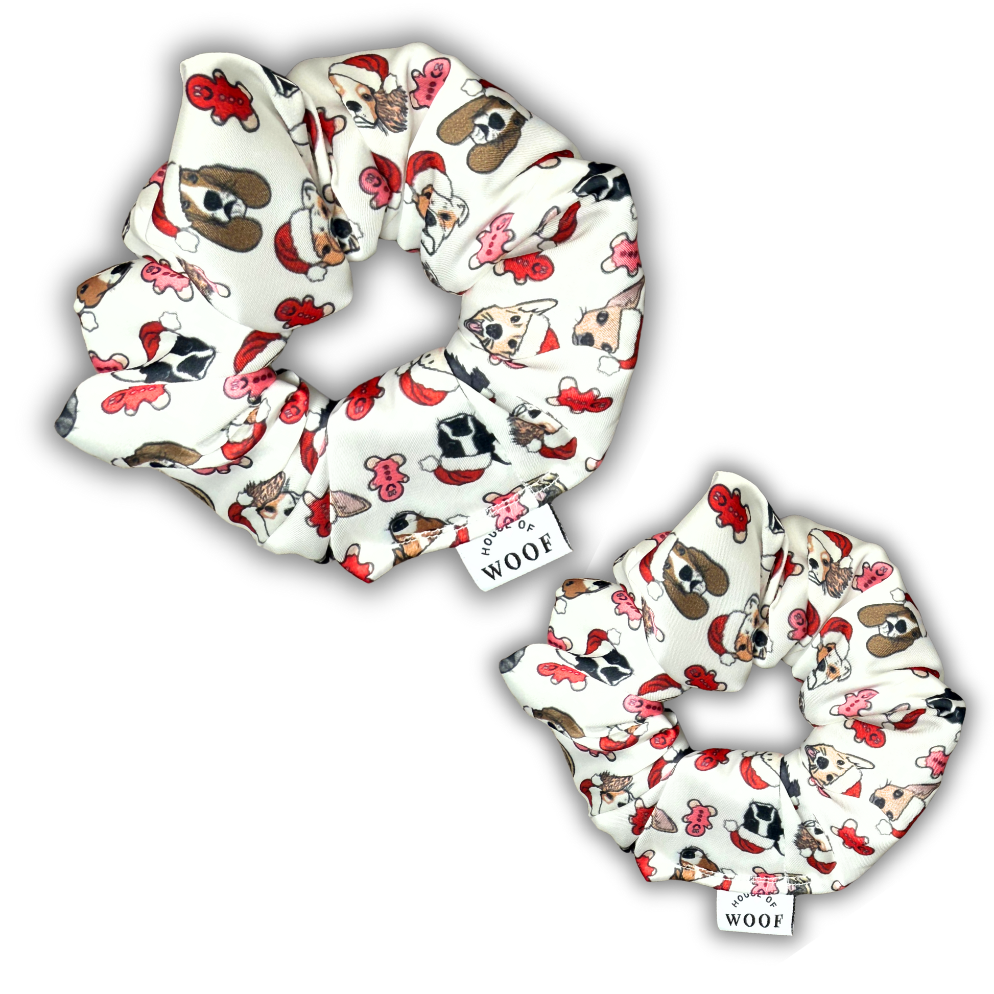 House of Woof Gingerbread scrunchies with hand-drawn dog illustrations wearing Santa hats surrounded by gingerbread cookies. Festive handmade accessories for dog lovers.