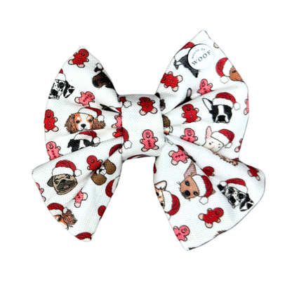House of Woof Gingerbread Christmas bow featuring hand-drawn dogs wearing Santa hats and surrounded by red gingerbread cookies. Festive dog accessory handmade in Melbourne.