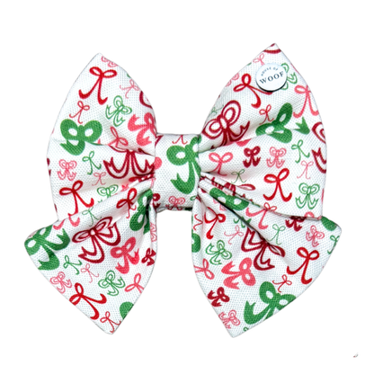 House of Woof Ribbon Christmas bow with red, green, and pink hand-drawn bow pattern on white fabric. Festive sailor bow for dogs and dog lovers